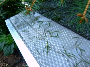 microscreen-gutter-cover-with-fir-needles